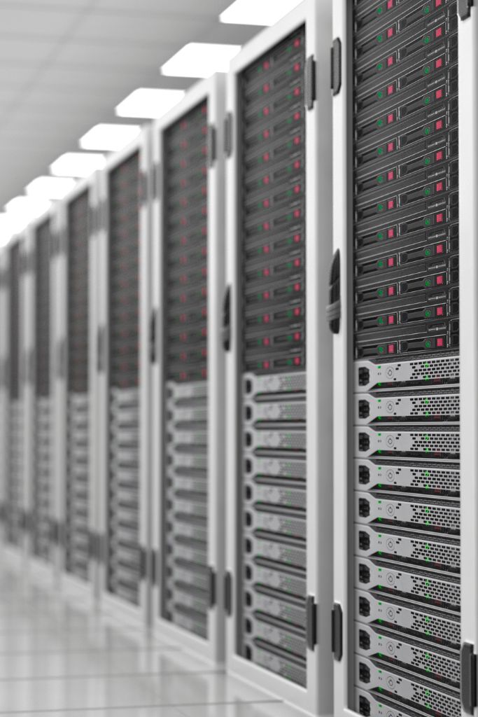 Server racks in a data center, representing IT network support services provided by IT GOAT in Austin.