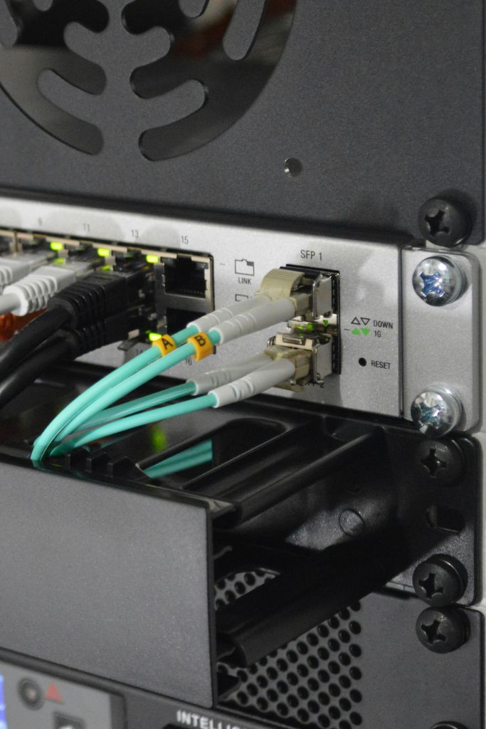 Network equipment and cables symbolizing the technical aspects of IT consulting provided by IT GOAT in Austin, TX.